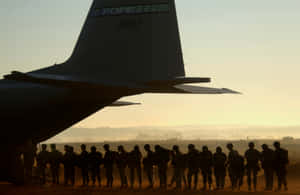 U.s. Army Troops Stand Ready To Defend Their Country With Courage And Valor On The Battlefield. Wallpaper