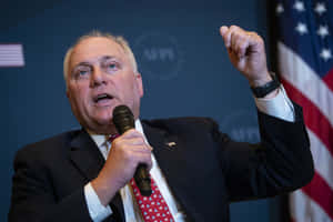 U.s. Representative Steve Scalise Raising His Fist In A Determined Stance Wallpaper