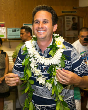 U.s. Senator Brian Schatz Wearing A Traditional Hawaiian Flower Wreath. Wallpaper