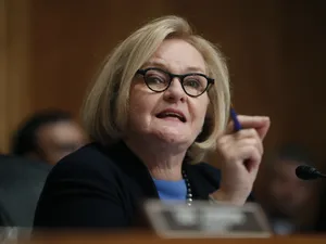 U.s. Senator Claire Mccaskill Pointing During A Senate Hearing Wallpaper