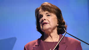 U.s. Senator Dianne Feinstein Delivering A Speech Wallpaper