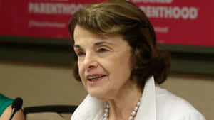 U.s. Senator Dianne Feinstein Wearing A Striking Pearl Necklace Wallpaper