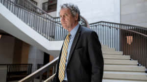 U.s. Senator Sherrod Brown Descending Stairs Wallpaper
