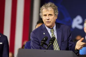 U.s. Senator Sherrod Brown Speaking At Podium Wallpaper