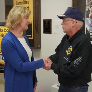 U.s. Senator Tammy Baldwin Shaking Hands With Constituents Wallpaper