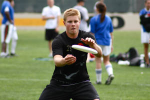 Ultimate Frisbee Player In Dynamic Action Wallpaper