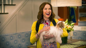 Unbreakable Kimmy Schmidt Kimmy Holding Dog Wallpaper