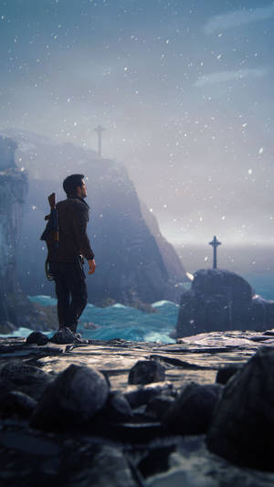 Uncharted Nathan Drake On Cliff Wallpaper