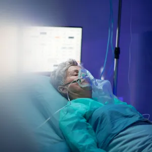 Unconscious Woman Receiving Medical Treatment In The Hospital Wallpaper