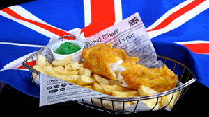 Unforgettable British Cuisine: A Classic Fish And Chips Wallpaper