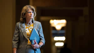 United States Senator Lisa Murkowski Walking In A Hallway Wallpaper