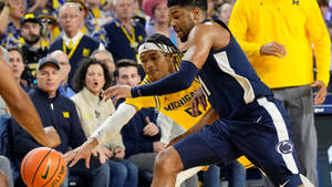 University Of Michigan-ann Arbor Collegiate Basketball Game Wallpaper