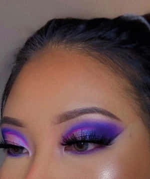 Unleash Your Inner Artist With Glamorous Purple Eye Shadow Wallpaper