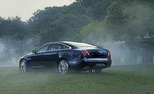 Unleash Your Power With The Smoky Black Jaguar Car Wallpaper