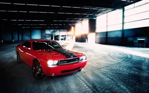 Unleash Your Wild Side With The Fierce Dodge Challenger Srt In Striking Red. Wallpaper