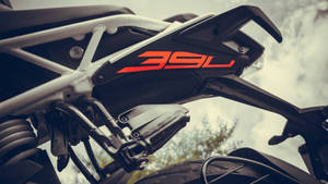 Unleashed Power - Ktm Duke 390 Engine Close-up View Wallpaper