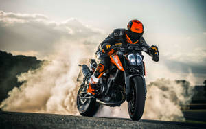 Unleashing Power - Ktm Duke 390 On Speedway Wallpaper