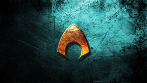 Unveil The Power Of Aquaman With The Official Golden Logo Wallpaper