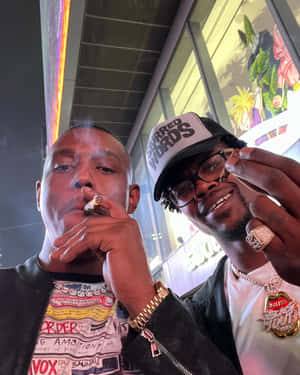 Unwinding Moments - Jamahal Hill Engages In A Casual Smoke With Kevin Holland Wallpaper