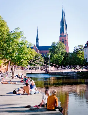 Uppsala Riverfront Summer Scene Wallpaper