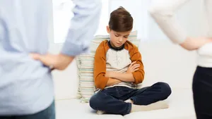 Upset Child Disciplinedby Parents Wallpaper