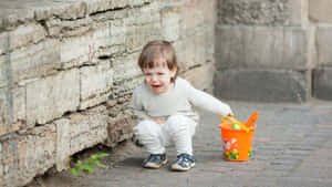 Upset Child With Bucket.jpg Wallpaper