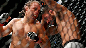 Urijah Faber Launching A Powerful Punch Wallpaper