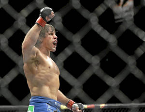 Urijah Faber Yelling And Raising Arm Wallpaper