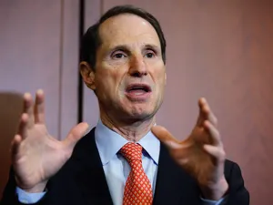 Us Senator Ron Wyden Actively Gesturing During A Speech Wallpaper