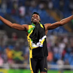 Usain Bolt Running And Cheering Wallpaper