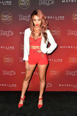 Vanessa Morgan Red Ensembleat Event Wallpaper