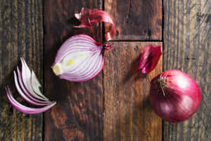Variety Of Fresh, Colorful Purple Onions At The Market Wallpaper