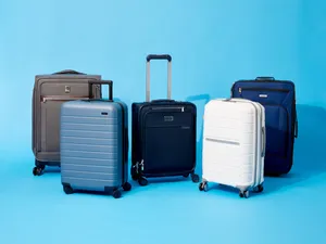 Varietyof Suitcaseson Blue Background Wallpaper