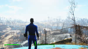 Vault Dweller Overlooking Post Apocalyptic Wasteland Wallpaper