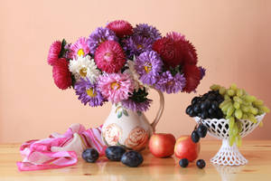 Vibrant Asters Bouquet In Elegant Vase Wallpaper