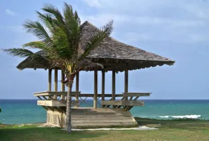 Vibrant Beach Huts Sitting On The Picturesque Shoreline Wallpaper