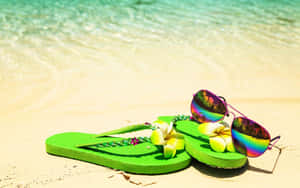 Vibrant Beach Sandals On Sandy Shore Wallpaper