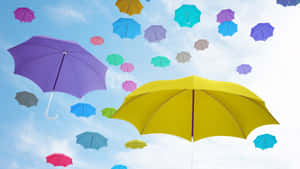 Vibrant Beach Umbrella On A Sunny Day Wallpaper