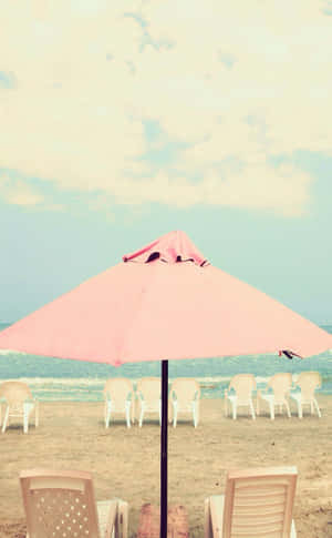 Vibrant Beach Umbrella On A Sunny Day Wallpaper
