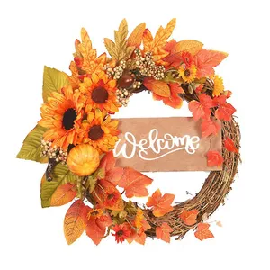 Vibrant Fall Wreath Adorning A Rustic Wooden Door Wallpaper
