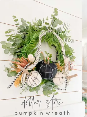 Vibrant Fall Wreath On Wooden Door Wallpaper