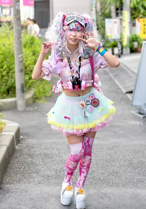 Vibrant Harajuku Fashionistas Expressing Individuality On The Streets Of Tokyo Wallpaper