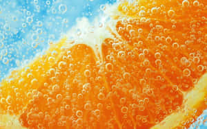 Vibrant Lemon Splash In Cool Water Wallpaper