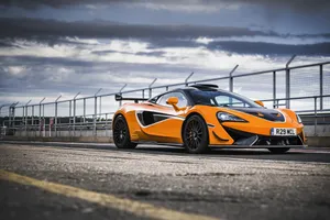 Vibrant Mclaren 620r On The Track Wallpaper