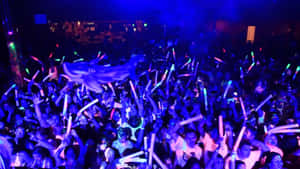 Vibrant Neon Party Crowd.jpg Wallpaper