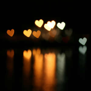 Vibrant Orange Heart On Dark Background Wallpaper