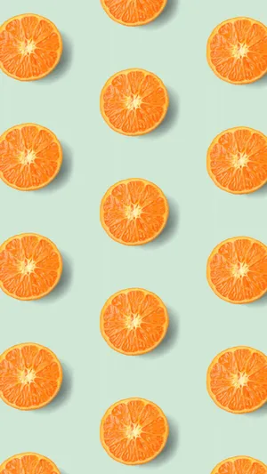 Vibrant Orange Slices Pattern Wallpaper