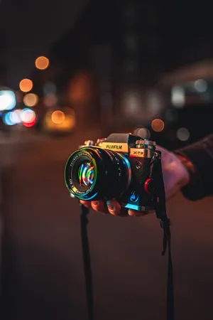 Vibrant Photography Passion: A Camera On A Colorful Street Wallpaper