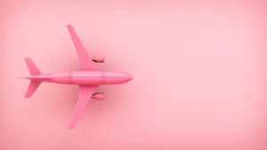 Vibrant Pink Toy Aeroplane Brightening Up The Sky Wallpaper