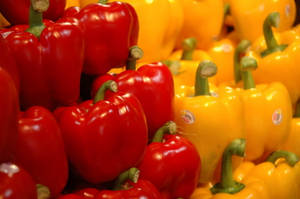 Vibrant Red And Yellow Bell Peppers Wallpaper